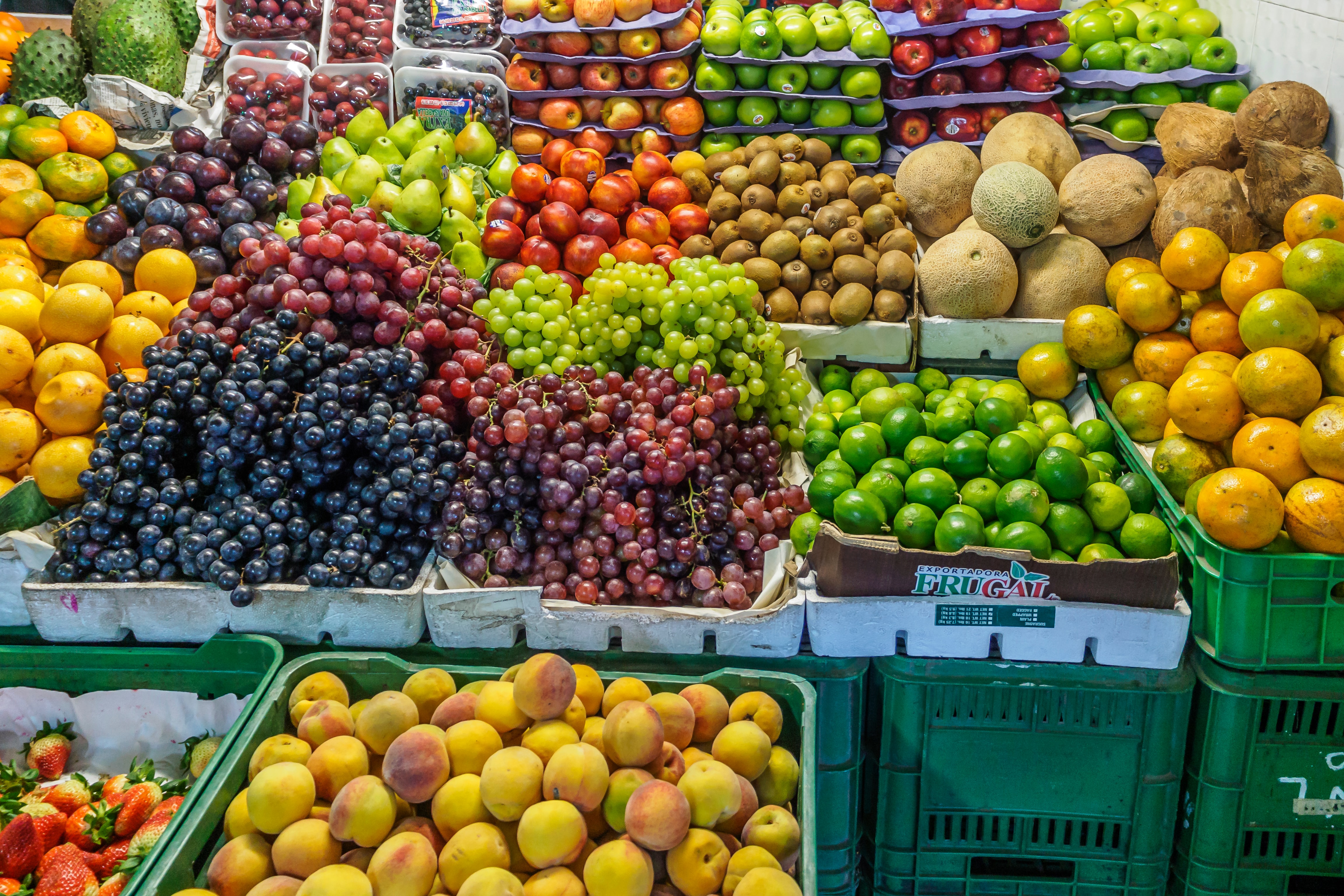Colorful fruits in a market place glowing with health.