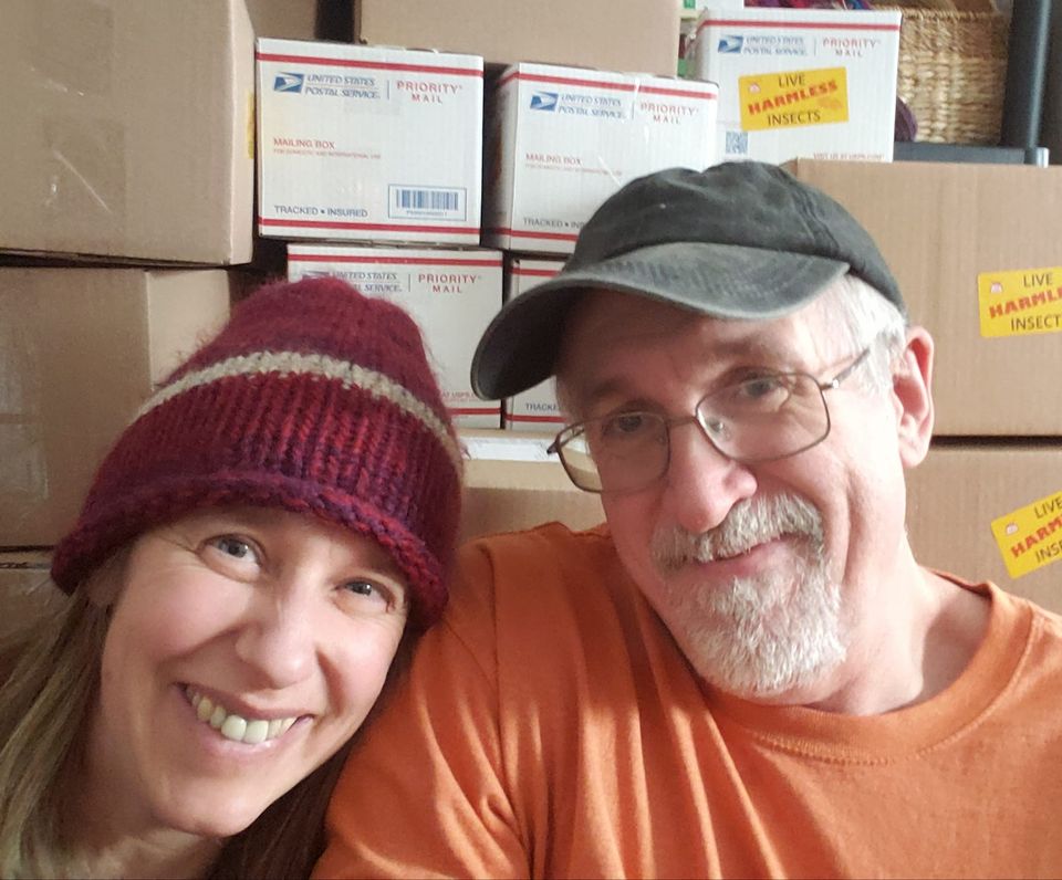 picture of Bug Shed owners Rich and Ona with shipping boxes