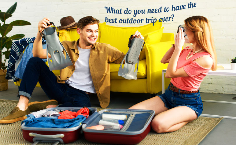 What do you need to have the best outdoor trip? A couple fixing their luggage for their travel.