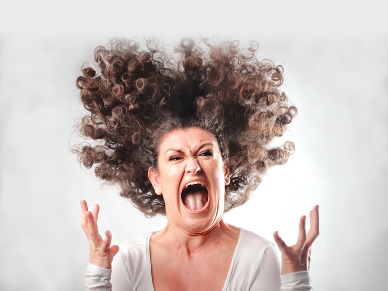 Woman shouting as if she's excited that our Heartland Location is reopening