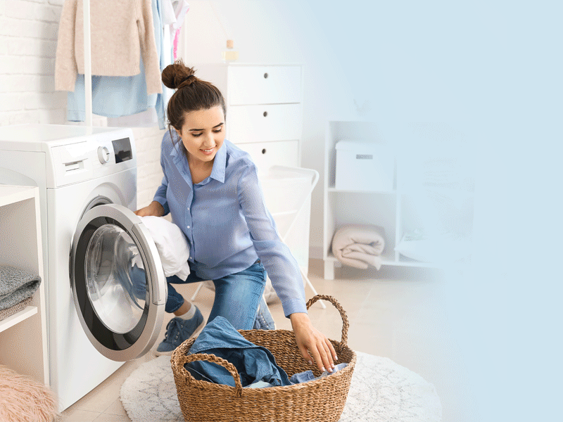 5 Solutions to make Laundry Day better! Woman loading the washer
